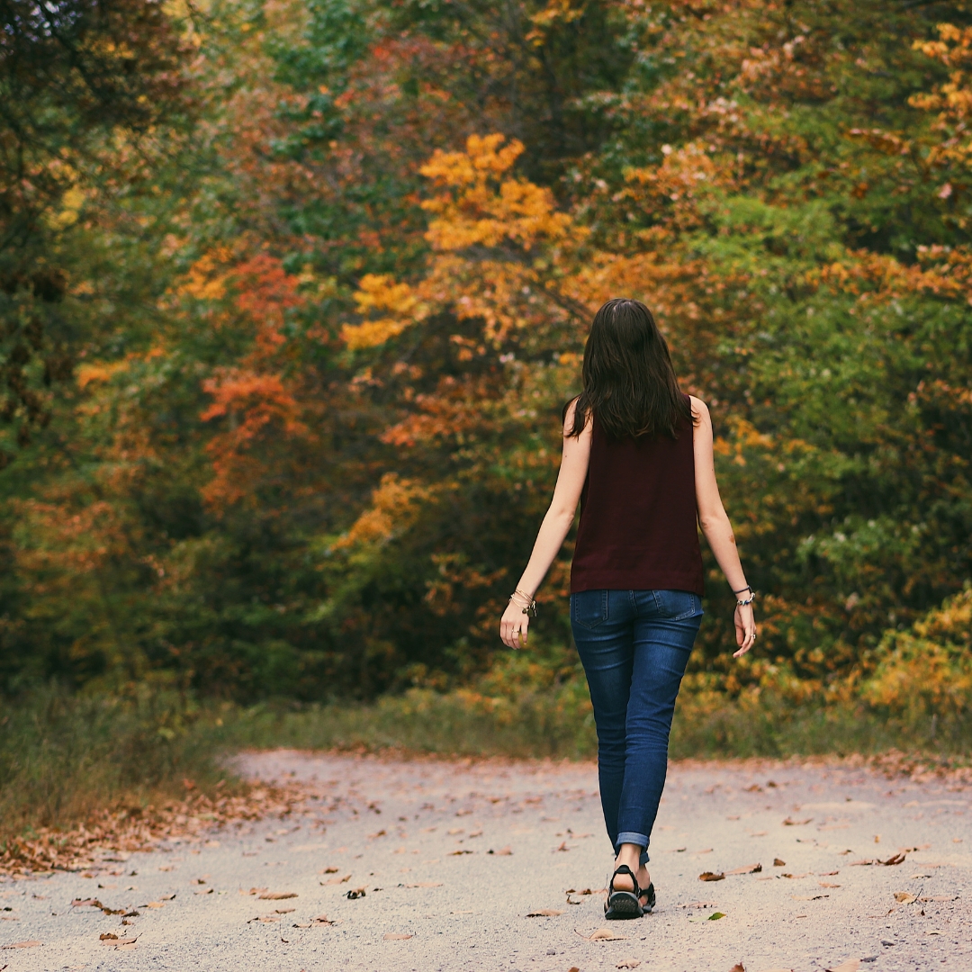 what-does-the-bible-say-about-gluttony-proverbs-28-7.jpg What does the Bible say about gluttony in Proverbs 28:7, shown by a woman walking along a quiet autumn path as a reminder to choose wisdom and self-control.